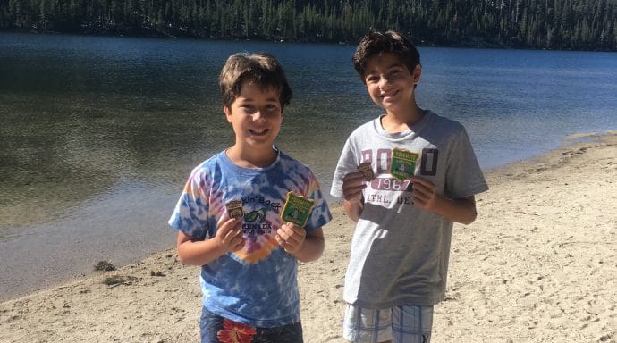 The boys showing off their Junior Ranger badges and patches at Yosemite National Park.