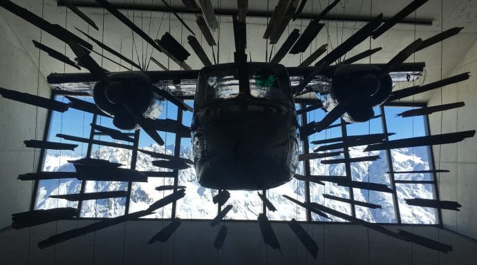 The plane looks like it is blasting through the window.