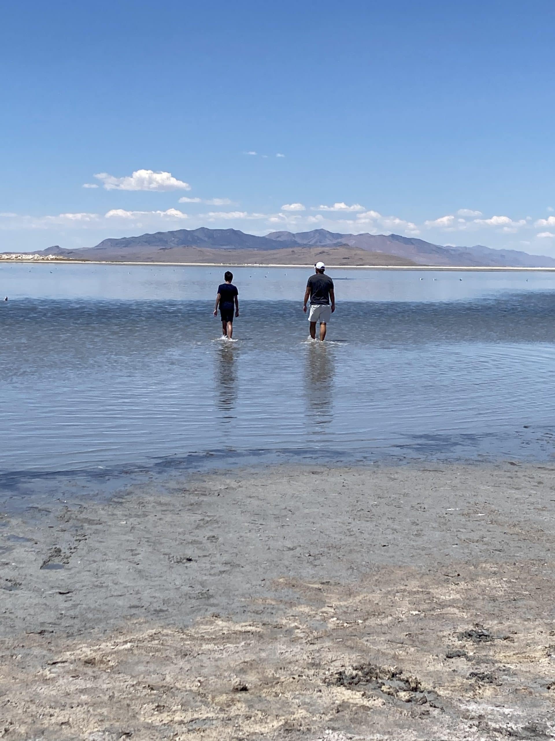 The boys enjoyed skipping rocks across the flat lake water.